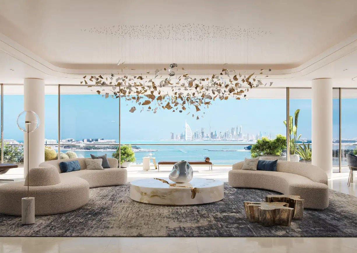 View of Yachtside Marina Residences at sunset with buildings, palm trees, and beach