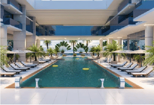 View of Yachtside Marina Residences at sunset with buildings, palm trees, and beach