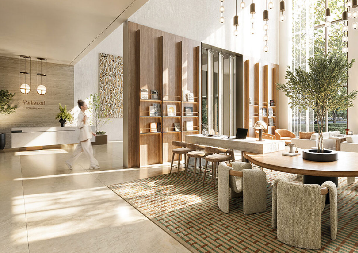 View of Yachtside Marina Residences at sunset with buildings, palm trees, and beach