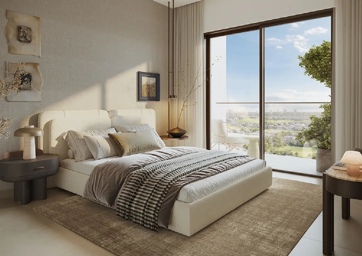 View of Yachtside Marina Residences at sunset with buildings, palm trees, and beach