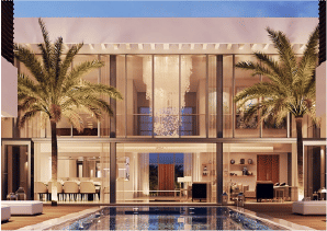 View of Yachtside Marina Residences at sunset with buildings, palm trees, and beach