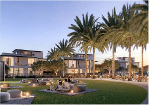 View of Yachtside Marina Residences at sunset with buildings, palm trees, and beach