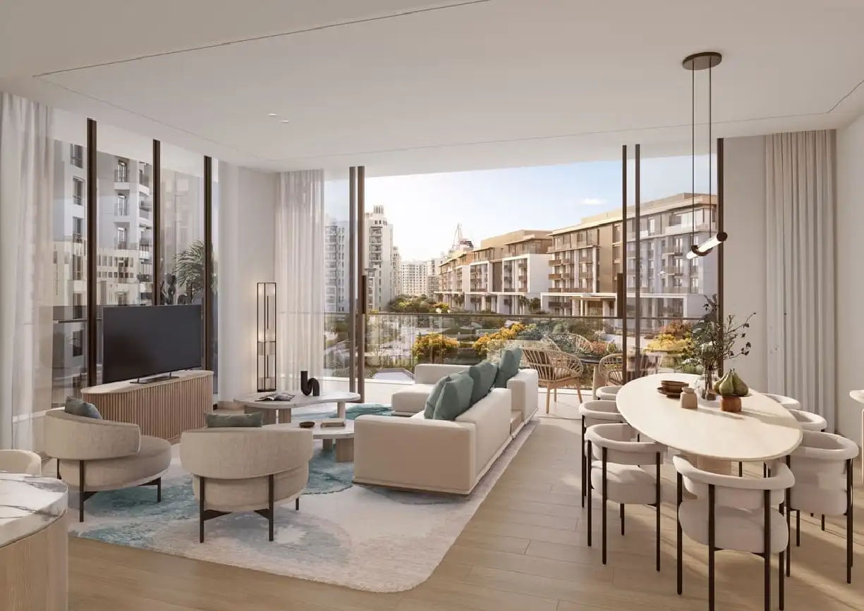 View of Yachtside Marina Residences at sunset with buildings, palm trees, and beach