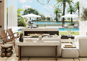 View of Yachtside Marina Residences at sunset with buildings, palm trees, and beach