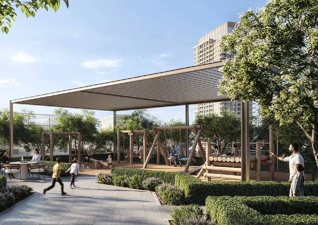 View of Yachtside Marina Residences at sunset with buildings, palm trees, and beach