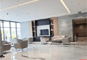 Interior view of a bedroom in Yachtside Marina Residences with large window and modern decor