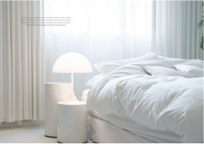 Interior view of a bedroom in Yachtside Marina Residences with large window and modern decor