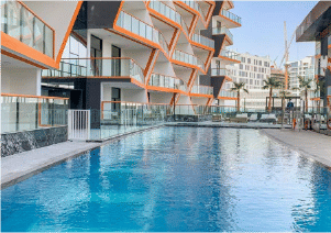 Interior view of a bedroom in Yachtside Marina Residences with large window and modern decor