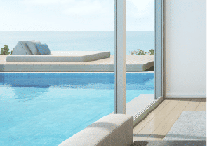 Interior view of a bedroom in Yachtside Marina Residences with large window and modern decor