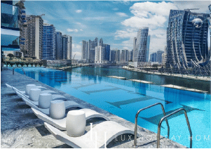 Interior view of a living and dining area in Yachtside Marina Residences with large windows and ocean view