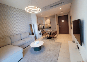 Interior view of a living and dining area in Yachtside Marina Residences with large windows and ocean view