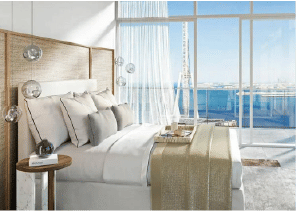 Interior view of a living and dining area in Yachtside Marina Residences with large windows and ocean view