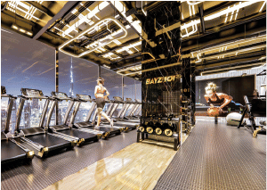 Interior view of a living and dining area in Yachtside Marina Residences with large windows and ocean view