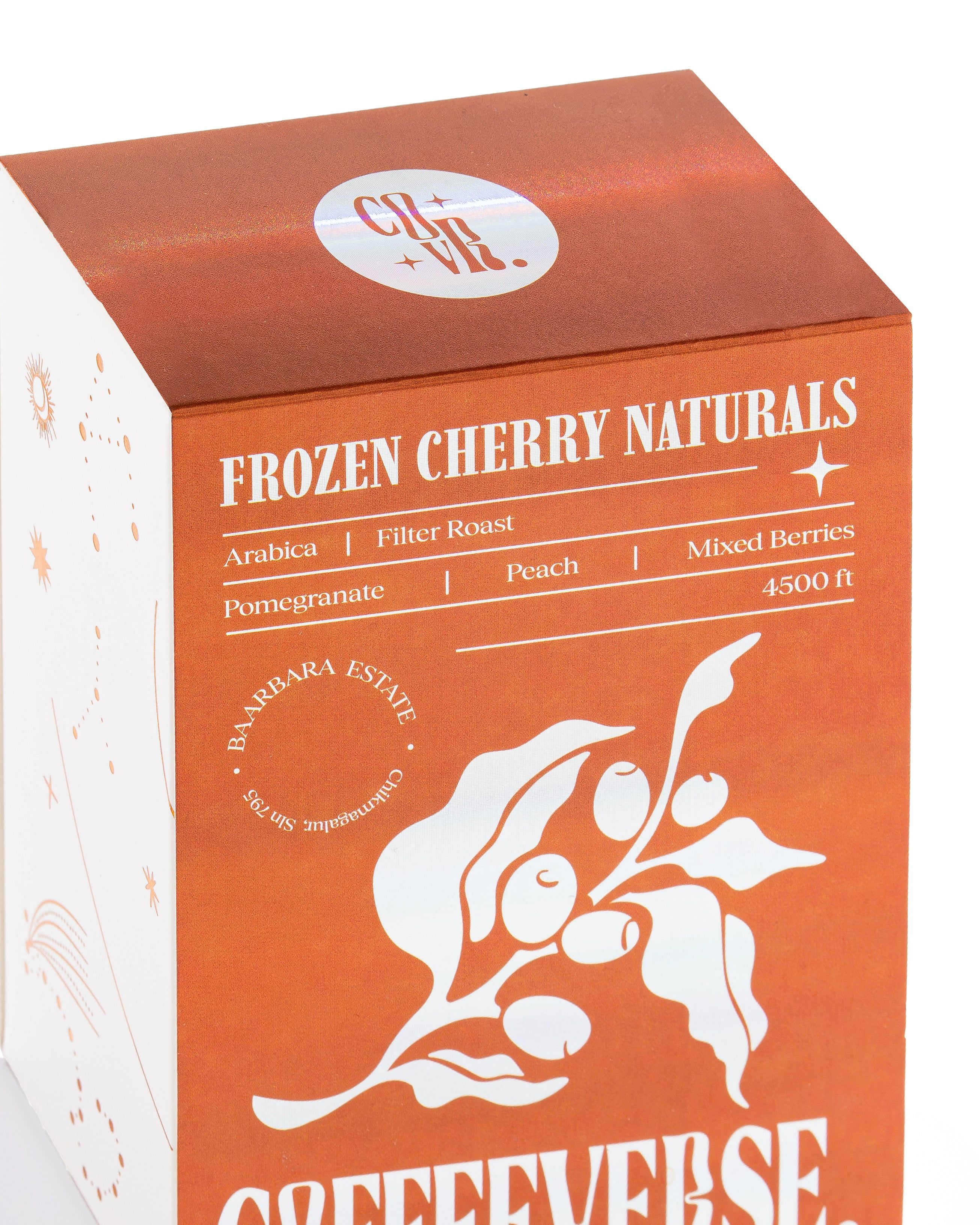 Coffee box labeled 'Frozen Cherry Naturals' with branding and product details on an orange background.