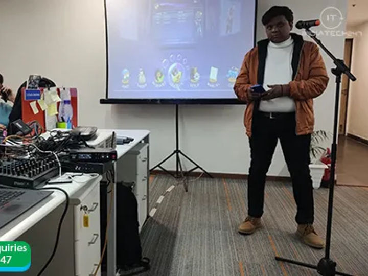 Rechargeable Bluetooth speaker with a mic used by a singer at a gathering