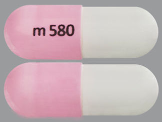 This is a Capsule Delayed And Er imprinted with m 580 on the front, nothing on the back.