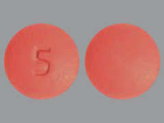 Esto es un Tableta rosado redondo imprimido con 5 en la parte delantera, nada en la parte posterior, y es fabricado por SCOV3 LLC.
