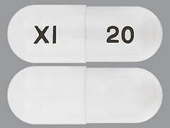 This is a white oblong Capsule Dr imprinted with XI on the front, 20 on the back, and is manufactured by XIROMED, LLC.