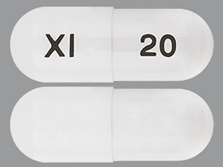 This is a Capsule Dr imprinted with XI on the front, 20 on the back.