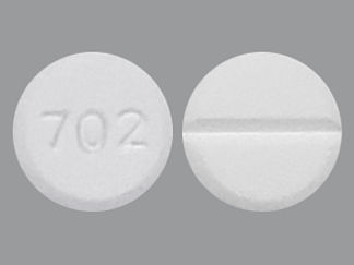 This is a Tablet Dose Pack imprinted with 702 on the front, nothing on the back.