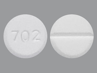 Esto es un Tableta Empaque De Dosis imprimido con 702 en la parte delantera, nada en la parte posterior, y es fabricado por None.