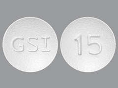 Esto es un Tableta blanco redondo imprimido con GSI en la parte delantera, 15 en la parte posterior, y es fabricado por GILEAD SCIENCES.