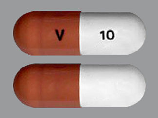 Esto es un Cápsula Er 24 Hr imprimido con V en la parte delantera, 10 en la parte posterior, y es fabricado por None.