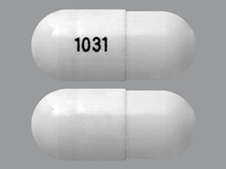 Esto es un Cápsula imprimido con 1031 en la parte delantera, nada en la parte posterior, y es fabricado por None.