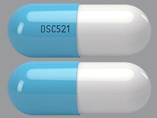 This is a Capsule imprinted with DSC521 on the front, nothing on the back.