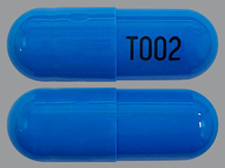 This is a Capsule Dr Biphasic imprinted with T002 on the front, nothing on the back.