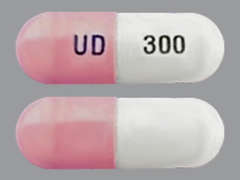 Esto es un Cápsula rosado oblongo imprimido con UD en la parte delantera, 300 en la parte posterior, y es fabricado por STRIDES PHARMA.