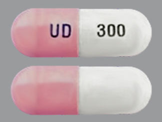 This is a Capsule imprinted with UD on the front, 300 on the back.
