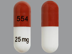 This is a caramel oblong Capsule imprinted with 554 on the front, 25mg on the back, and is manufactured by SOLCO HEALTHCAR.