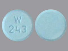 This is a blue round Tablet imprinted with W  243 on the front, nothing on the back, and is manufactured by EYWA PHARMA INC.
