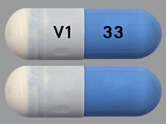 This is a Capsule imprinted with V1 on the front, 33 on the back.