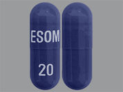 Esomeprazole Magnesium: This is a dark blue oblong Capsule Dr imprinted with ESOM on the front, 20 on the back, and is manufactured by ASCEND LABORATO.