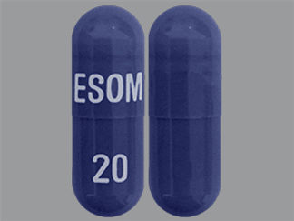 This is a Capsule Dr imprinted with ESOM on the front, 20 on the back.
