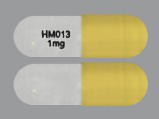 Esto es un Cápsula imprimido con HM013  1mg en la parte delantera, nada en la parte posterior, y es fabricado por None.