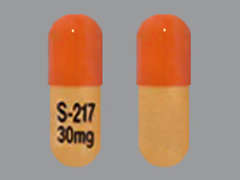 This is a light orange oblong Capsule imprinted with S-217  30mg on the front, nothing on the back, and is manufactured by BIOGEN-IDEC.