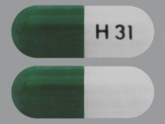 This is a Capsule Er Multiphase 24hr imprinted with H 31 on the front, nothing on the back.