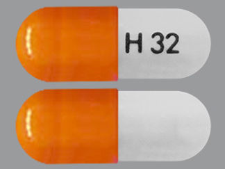 This is a Capsule Er Multiphase 24hr imprinted with H 32 on the front, nothing on the back.