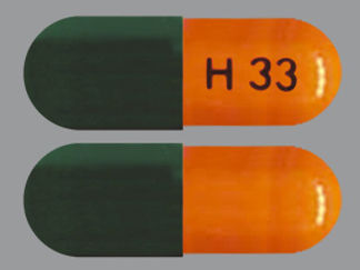 This is a Capsule Er Multiphase 24hr imprinted with H 33 on the front, nothing on the back.