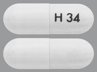 This is a Capsule Er Multiphase 24hr imprinted with H 34 on the front, nothing on the back.