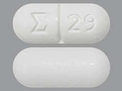 Esto es un Tableta blanco oblongo imprimido con logo and 29 en la parte delantera, nada en la parte posterior, y es fabricado por SIGMAPHARM LABO.