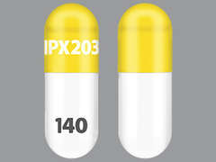 This is a yellow oblong Capsule Immediate Extend Release Biphase imprinted with IPX203 on the front, 140 on the back, and is manufactured by AMNEAL PHARMACE.