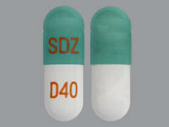 This is a green oblong Capsule Er Biphasic 50-50 imprinted with SDZ on the front, D40 on the back, and is manufactured by SANDOZ INC..