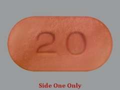This is a brown oblong Tablet Dr imprinted with 20 on the front, nothing on the back, and is manufactured by RUGBY.