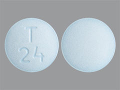 This is a blue round Tablet imprinted with T  24 on the front, nothing on the back, and is manufactured by QUAGEN PHARMACE.