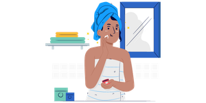 A woman applying skin cream on her face.