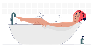 Woman relaxing in a bathtub